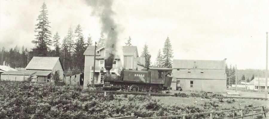Dannaher Logging locomotive coming through town, photo Darrington Historical Society